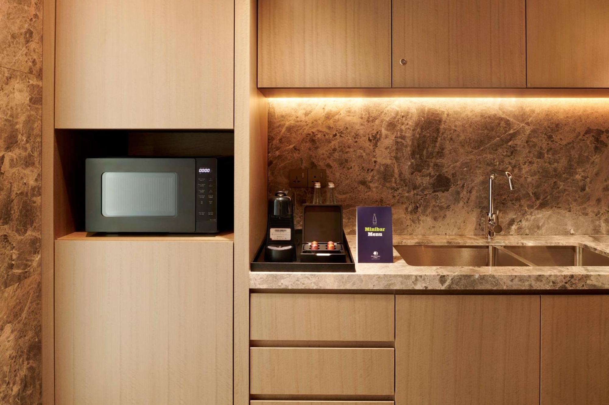 Doubletree By Hilton Shah Alam I-City Bagian luar foto A microwave oven in a kitchen